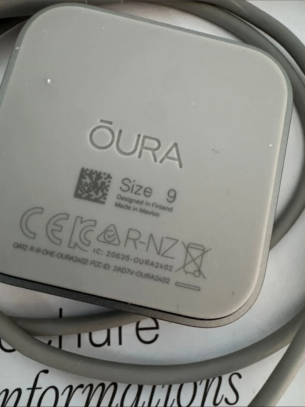 Oura Ring 4 Charging Dock and USB-C Cable in Light Gray